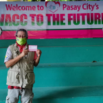 Sports journalist Peter Atencio gets his first Sinovac jab at the the Andres Bonifacio Elementary School in Pasay City on April 10, 2021.