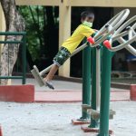 A boy rides a standing swing at the Bernardo Park in Barangay Kamuning, Quezon City on Tuesday (July 13, 2021). The city government has identified ‘child-friendly safe zones’ which include outdoor playgrounds and parks for children five years old and above. (PNA photo by Robert Oswald P. Alfiler)