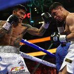 Mark Magsayo (L) of the Philippines fights against Julio Ceja of Mexico during the WBA Featherweight Title Eliminator boxing match at T-Mobile Arena in Las Vegas, Nevada on August 21, 2021. (Aug. 22 PH time) (Photo by Patrick T. FALLON / AFP)