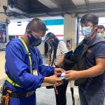 A man showing his ID and vaccination card to acquire the free ride offered by the Department of Transportation. (Photo courtesy of DOTr MRT-3 FB page)