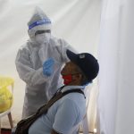 A resident undergoes a free swab test for Covid-19 at the Telemedicine and Park N’ Test facility at the Vista Mall Parking Building in Barangay Tuktukan, Taguig City on Friday (March 19, 2021). The country continues to ramp up its testing efforts while awaiting the arrival of Covid-19 vaccines. (PNA photo by Avito C. Dalan)