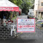 Two Barangay UP Campus personnel man the post on Castañeda St., which is now under a special concern lockdown, in Quezon City on Friday (Oct.15, 2021). The alert level status in Metro Manila will be downgraded to Alert Level 3 from the current Alert Level 4 beginning Oct. 16. (PNA photo by Joey O. Razon)