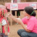 A woman feeding lugaw to a child as part of their Lugaw-one campaign in support of presidential aspirant, Vice President Leni Robredo.  (Photo from F1rst Ko Si Leni Facebook page)