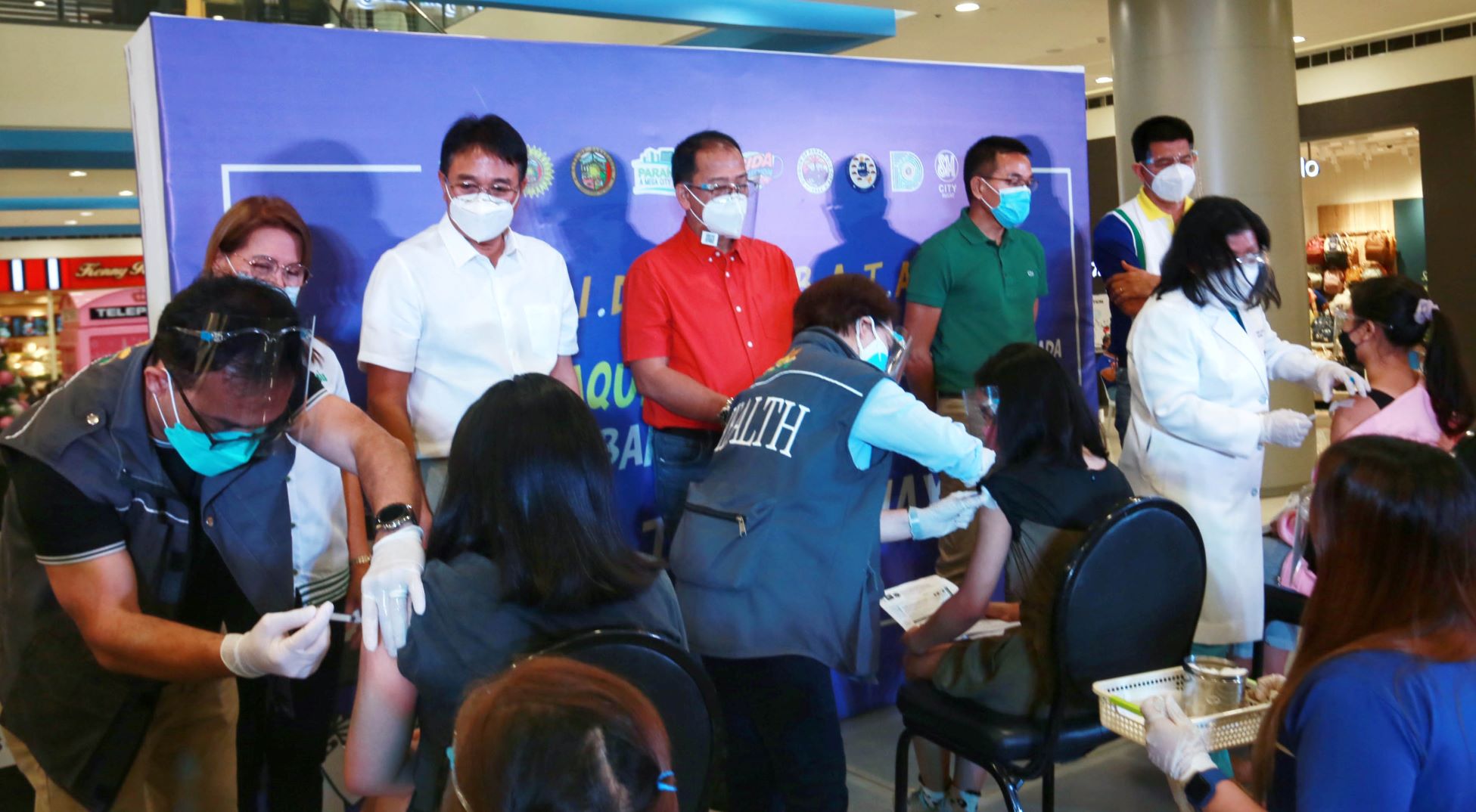 National Task Force against COVID-19 chief implementer and vaccine czar, Secretary Carlito Galvez Jr. (in red polo), together with officials of the Department of Health and the Parañaque City government witness the rollout of COVID-19 vaccination for the general pediatric population at the SM Sucat in Parañaque City on Wednesday (Nov. 3). The government targets to administer at least 15 million doses of COVID-19 vaccines before the end of November. (PNA photo by Avito Dalan)