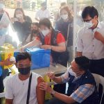 DOH Sec. Francisco Duque III and MMDA Chairperson Benhur Abalos inspects the ongoing vaccination against COVID-19 at Batasan National High School, Quezon City in connection with the first day of National Vaccination Days. (File photo by Patrick de Jesus/PTV)