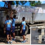 Police officers inspect boxes of smuggled cigarettes seized at a checkpoint in Makilala, North Cotabato, and the handgun (inset) seized from one of the five suspects. The Police Regional Office in Soccsksargen said the cargo truck was on its way to General Santos City, passing through Makilala town early Sunday morning (Nov. 14, 2021). (Photo courtesy of PRO-12 via PNA)