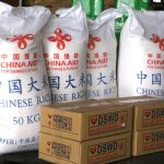 China-donated rice and packs of relief supplies are seen in Pasay City, the Philippines, Dec. 22, 2021. China offered 1 million U.S. dollars in cash and another 4,725 tons of rice on Wednesday to help the victims of Typhoon Rai in the Philippines. (Xinhua/Liu Kai)