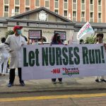 Nurses United Partylist members gathered in front of the Comelec building to protest not being included in the Comelec’s list of approved partylists for the upcoming 2022 elections. (Photo from Karen Villanda/PTV)