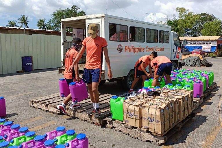 PCG members source gallons of water to typhoon victims