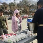 A Navy personnel gives hot meals to typhoon-hit residents at the Port of San Jose in Dinagat Islands province on Tuesday (Dec. 21, 2021). The feeding activity conducted by personnel of the Navy’s patrol craft BRP Rafael Pargas benefited 200 residents. (Photo courtesy of Philippine Navy via PNA)