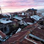 Houses were destroyed by Typhoon Odette in the coastal village of Asuncion in Maasin City, Southern Leyte. (Photo courtesy of Farimae Urbano via PNA)
