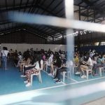 Adults and teenagers queue up for vaccines at the multipurpose hall of Barangay Kaligayahan in Novaliches, Quezon City on Wednesday (Dec. 1, 2021). A total of 37.3 million Filipinos are already fully vaccinated as of December 2. (PNA photo by Oliver Marquez)