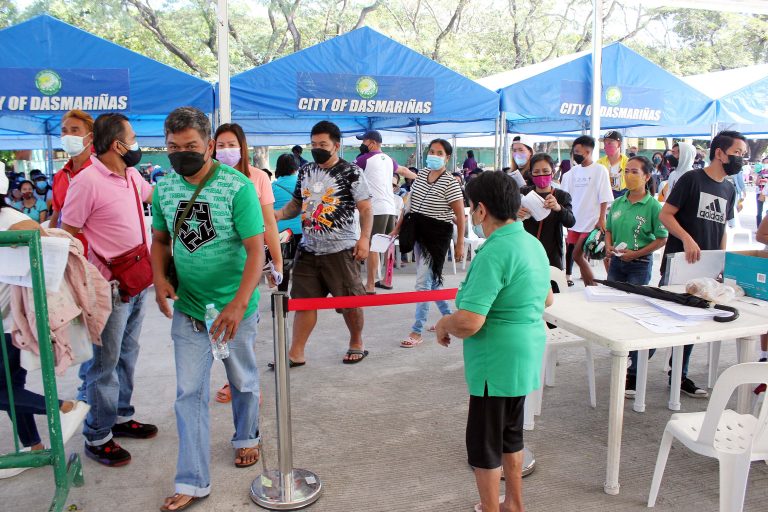 Walk-in vaccinees line up to get their first dose of Johnson & Johnson vaccine at The Tent, DIHS (former DNHS Main High School), Barangay Burol 1, City of Dasmarinas, Cavite. (PNA photo by Gil Calinga)