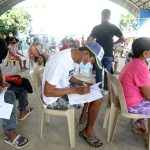 Residents of Peñaranda, Nueva Ecija fill out the personal data form before getting their coronavirus shots at the Peñaranda City Hall covered court on Monday (Jan. 24, 2022). Local officials have campaigned for the vaccination against the coronavirus, prompting residents to get their first dose and booster shots. (PNA photo by Oliver Marquez)