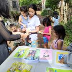 Members of the Coloring Book Hub project distributing books to children in areas affected by the Pandemic. (Photo from Coloring Book Hub Philippines)