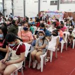 Young vaccinees with their parents and guardians wait for their turn to get the first dose of the reformulated Pfizer Covid-19 jab at the Ugnayang La Salle gymnasium in Dasmariñas City, Cavite on Saturday (Feb. 19, 2022). Officials said inoculating children will allow the safe reopening of physical classes. (PNA photo by Gil Calinga)