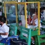 Students of Napo Elementary School (NES) in Barangay Napo, Linamon, Lanao del Norte are separated by makeshift cubicles as face-to-face classes start on Nov. 15, 2021. (PNA photo by Divina M. Suson)