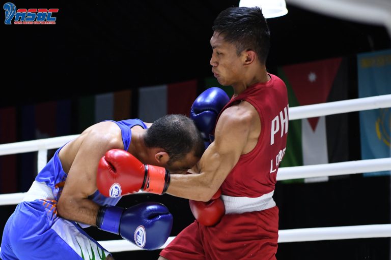 Rogen Ladon (right) connects with a left uppercut to Amit Panghal of India during their men's flyweight gold medal bout in the 2022 Thailand Open International Boxing Tournament at the Angsana Laguna Phuket Resort Hotel. Ladon nabbed the gold after scoring a 3-2 split decision victory. (ABAP photo release)