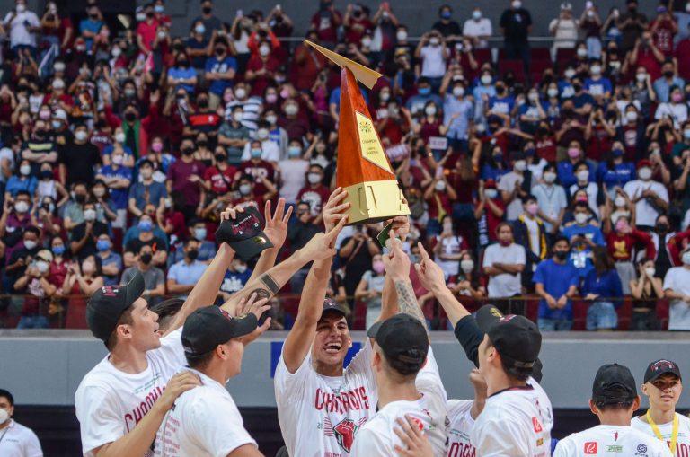 The UP Fighting Maroons whoop it up after winning the UAAP Season 84 Men's Basketball title over the Ateneo Blue Eagles, 72-69, in overtime at the Mall of Asia Arena on Friday, May 13. [photo credit: UAAP Media Group]