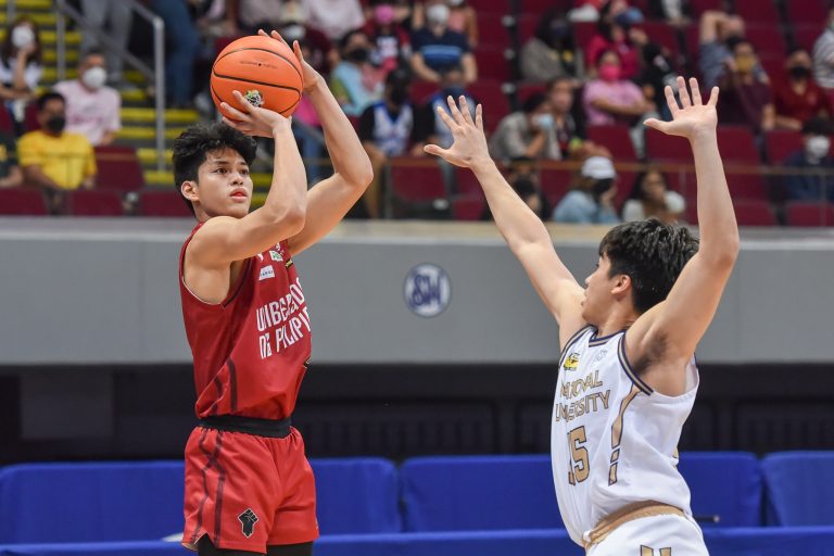 Ricci Rivero of the UP Fighting Maroons (L) goes up for a shot against an NU defender. [photo credits: UAAP media group]