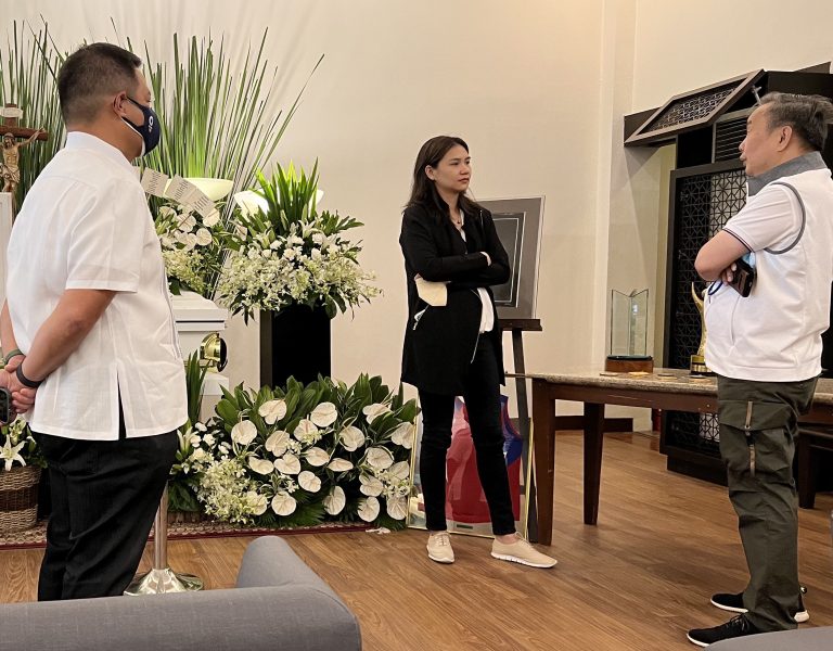 Philippine Olympic Committee President Rep. Abraham “Bambol” Tolentino (R) speaks with Stephanie Mercado-Koenigswarter. At left is POC secretary general for international affairs Bones Floro. [POC photo release]