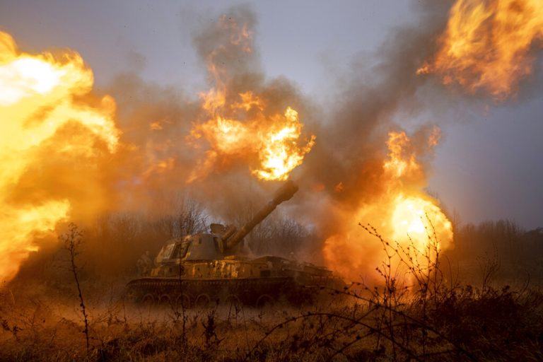 A Ukrainian self-propelled artillery shoots towards Russian forces at a frontline in Kharkiv region, Ukraine, Saturday, Dec. 24, 2022. (AP Photo/Evgeniy Maloletka)