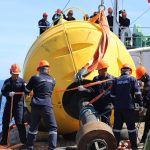 The Philippine Coast Guard (PCG) installs additional buoys in the Kalayaan Island Group, May 2023. (Photo courtesy of PCG)