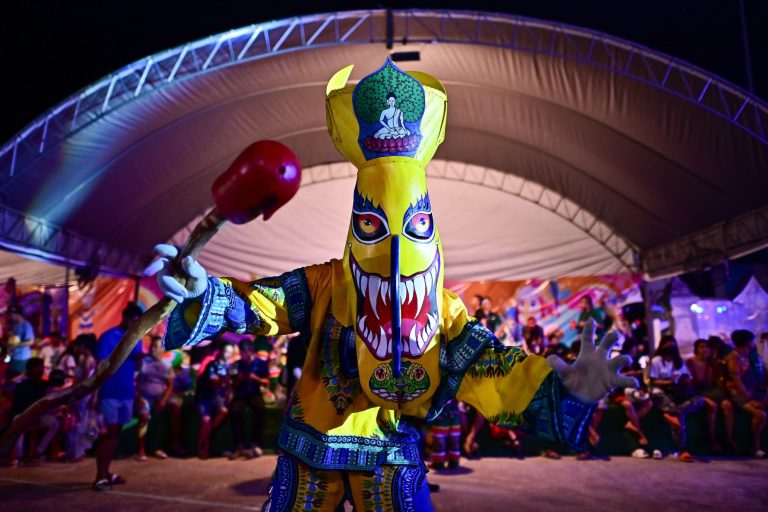 Thais don ghost masks to summon spirits at annual festival