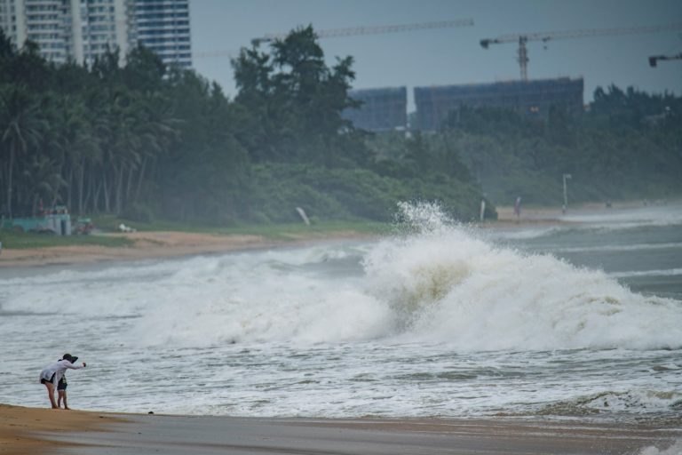 Thousands evacuated as typhoon nears southern China, Vietnam