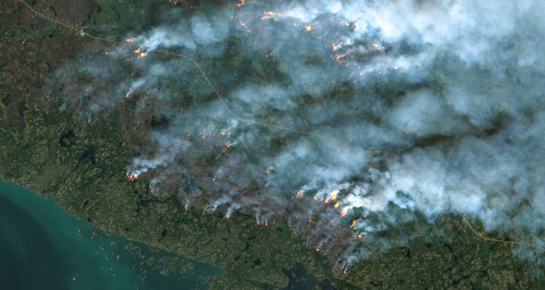 Wildfires threaten western Canada city as far north evacuated