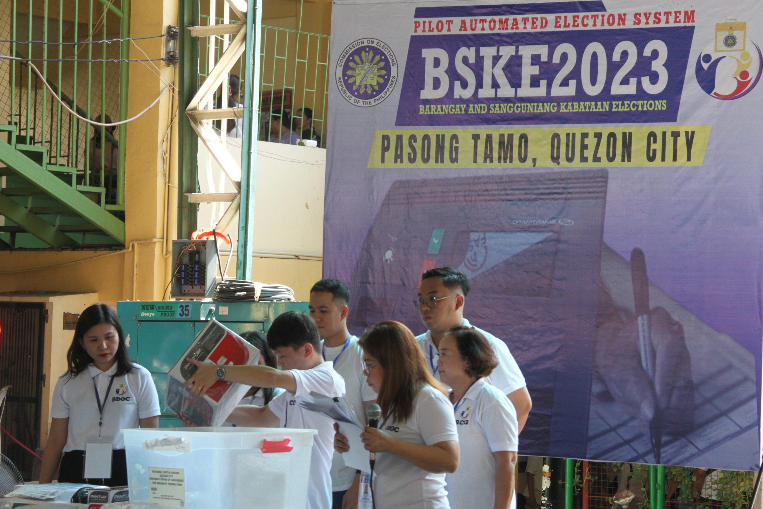 Personnel of the Barangay Board of Canvassers conduct a pilot test of
