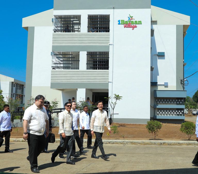 Marcos turns over Balanga housing units to 216 relocated families