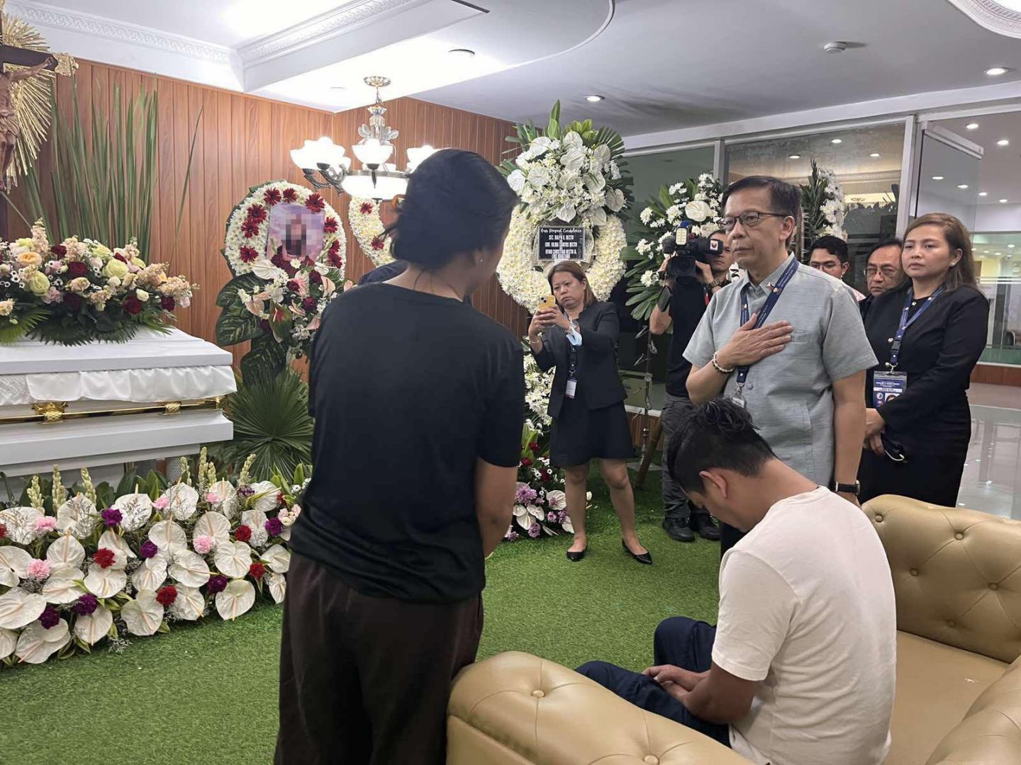 DMW Sec Cacdac visits wake of casualty at NAIA car-ramming incident